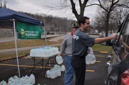 AFP staff deliver water to victims of coal industry